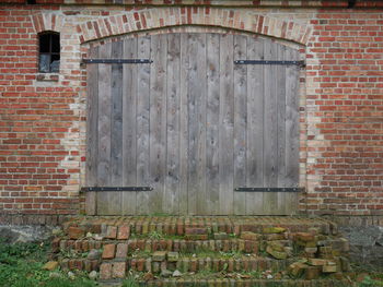 Brick wall with closed door