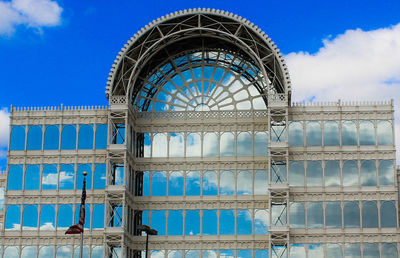 Low angle view of building against cloudy sky