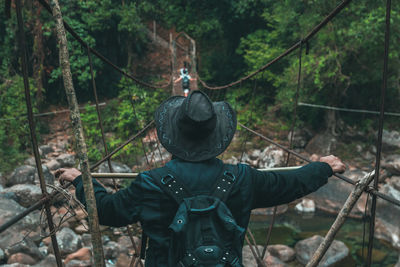 Rear view of person in forest