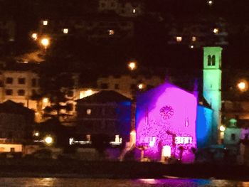 Illuminated buildings in city at night