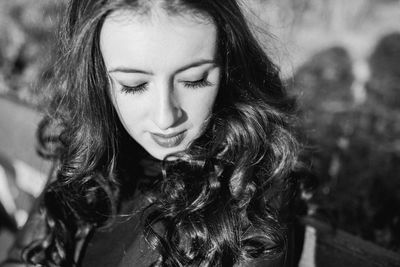 Portrait of young woman looking down