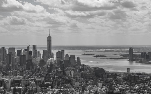 High angle view of buildings against cloudy sky