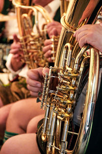 Close-up of man playing horn