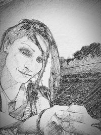 Close-up portrait of woman against the sky