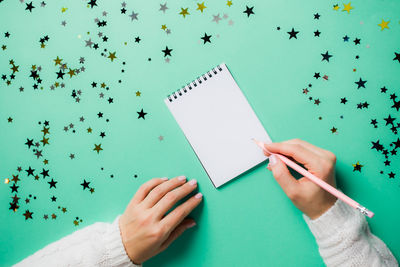 Low section of person holding paper flying