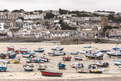 Boats moored at harbor