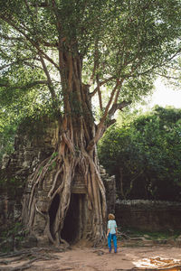 Rear view full length of woman entering temple