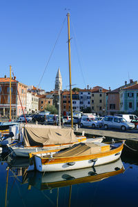 Boats moored at harbor