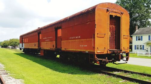 Train on railroad track against sky