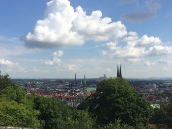 High angle view of city against cloudy sky