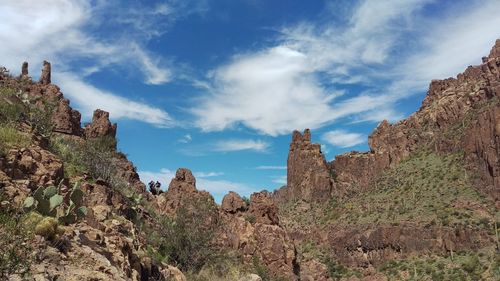 Low angle view of rocks against sky