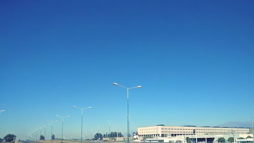 Low angle view of buildings against blue sky