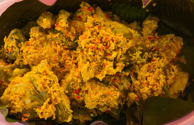 High angle view of yellow flowering plants at market