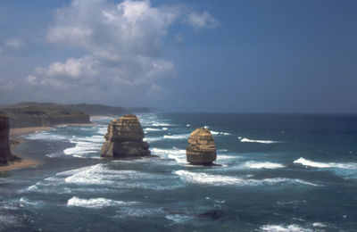 Scenic view of sea against cloudy sky