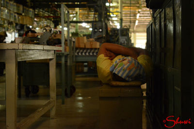 Man sitting on seat in city