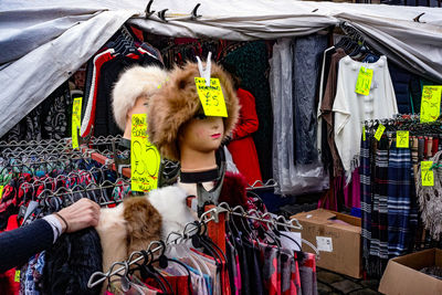 Young man hanging in market stall