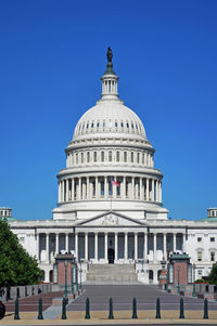 Low angle view of building against blue sky