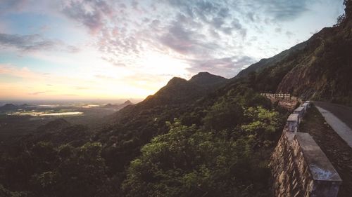 Scenic view of mountains against cloudy sky