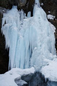 Frozen waterfall on rocks