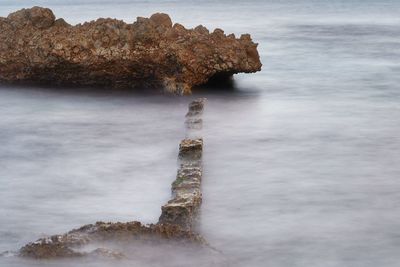 Stone object in water 