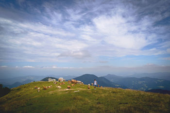 Scenic view of landscape against cloudy sky