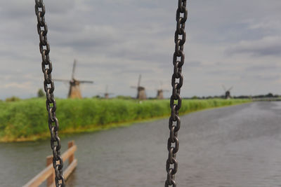 Close-up of chain swing hanging on field
