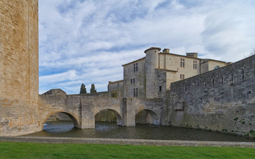 View of old building against cloudy sky