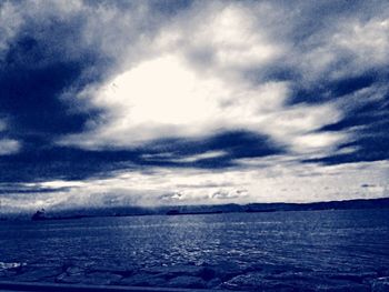 Scenic view of sea against cloudy sky