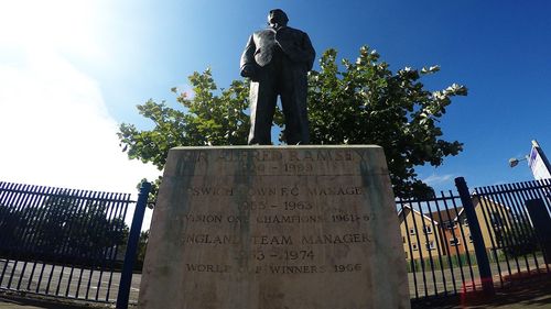 Low angle view of statue against sky