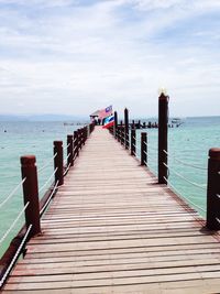 Pier on sea against sky