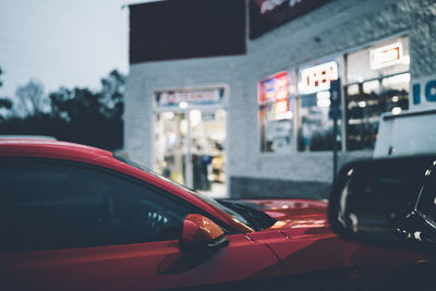 Close-up of red car in city