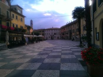 Street amidst buildings against sky