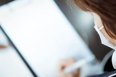 Close-up of woman using mobile phone