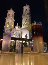 Low angle view of illuminated building at night