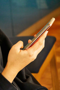 Close-up of woman using mobile phone