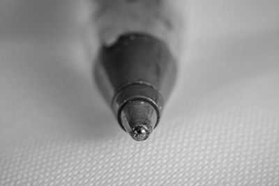 Close-up of ballpoint pen on table