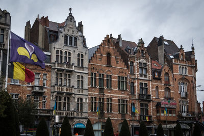 Low angle view of buildings in city against sky