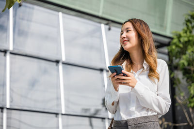 Young woman using mobile phone