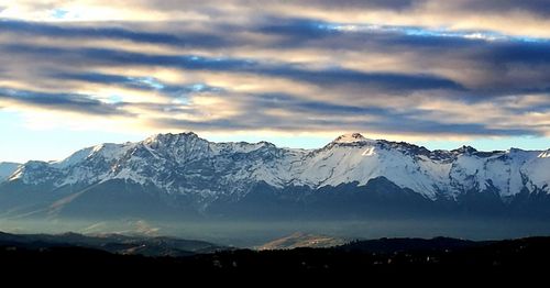 Scenic view of snowcapped mountains against sky