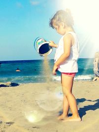 Full length of young woman on beach