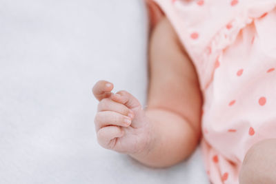 Close-up of baby boy lying on bed