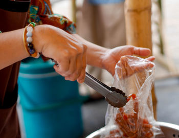 Close-up of hand holding ice cream