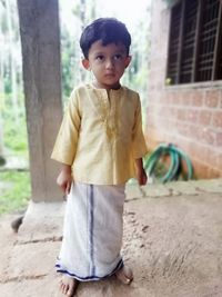 Portrait of boy standing outdoors