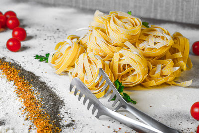 Close-up of pasta and ingredients on table