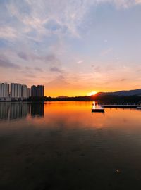 Scenic view of lake against sky during sunset