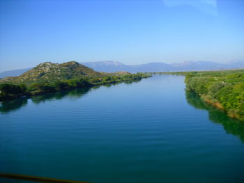 Scenic view of lake against blue sky