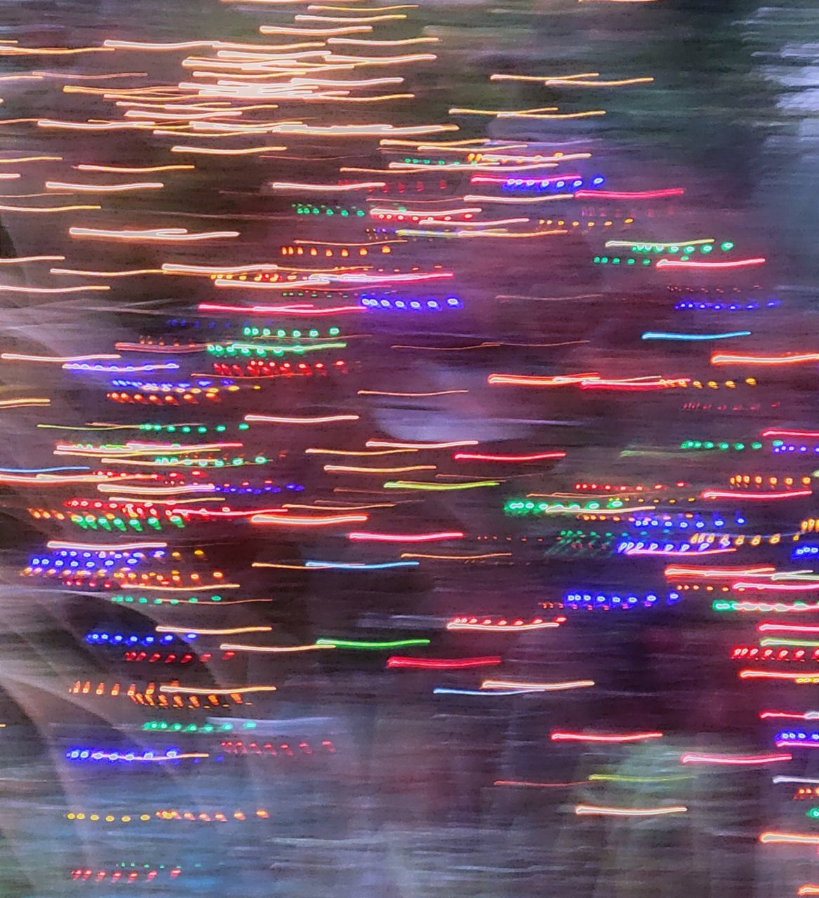 multi colored, illuminated, no people, motion, light, night, city, long exposure, reflection, pattern, blurred motion