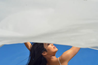 Dancer rino kamimura posing for a photo at coney island, new york city.