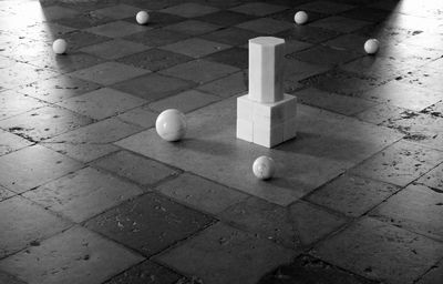 High angle view of marble balls on tiled floor