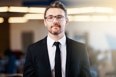 Portrait of businessman standing in office